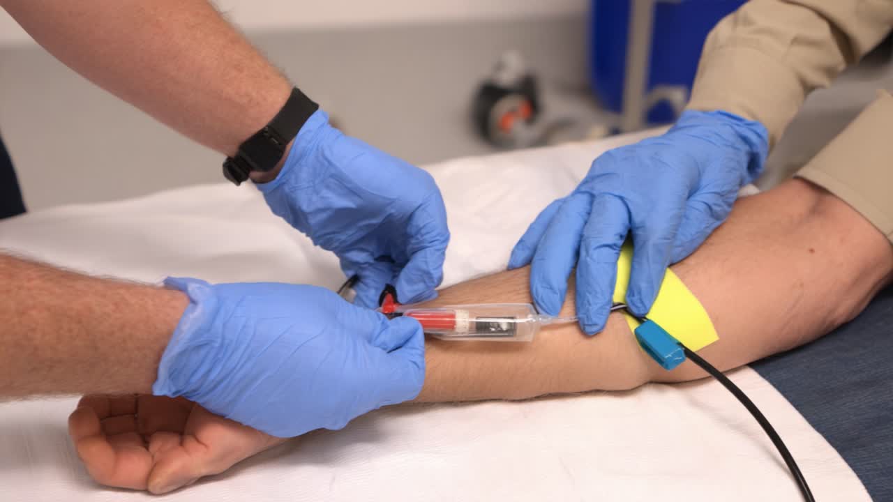 Medical Procedure: Healthcare Professionals Administering IV Access Using a Catheter to Ensure Safe and Effective Patient Treatment