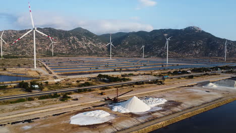 aerial view of salt fields spread across windmill farm in phan rang