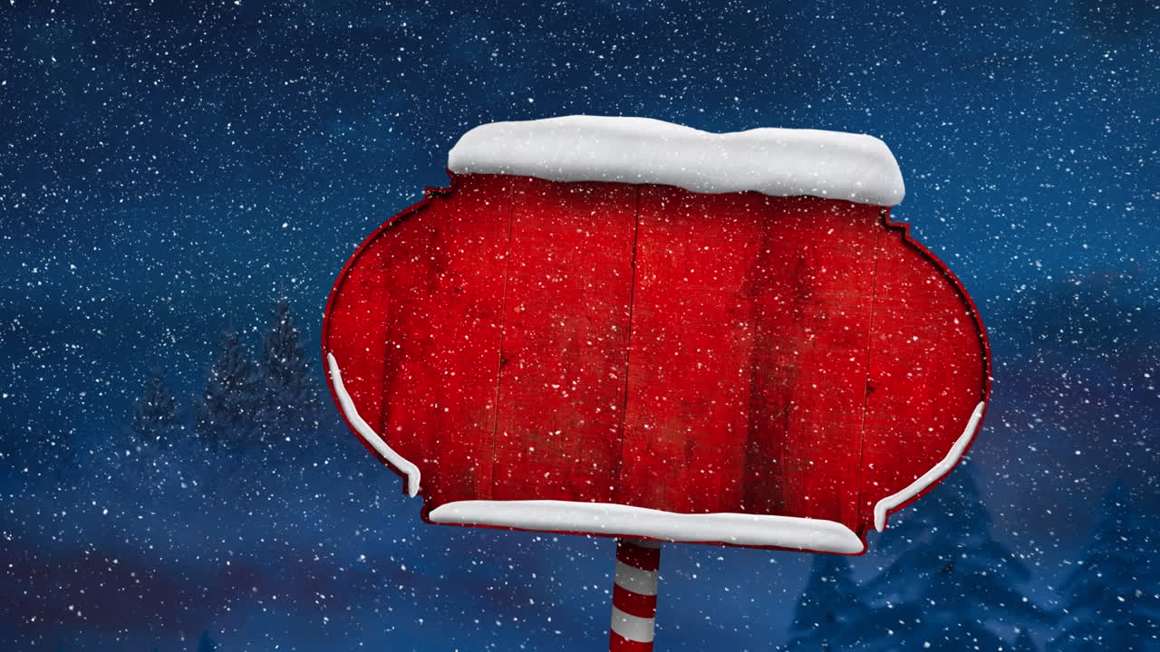 Snow falling over snow covered red sign post against blue background
