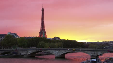 colorful sunset in paris with the seine river in sight