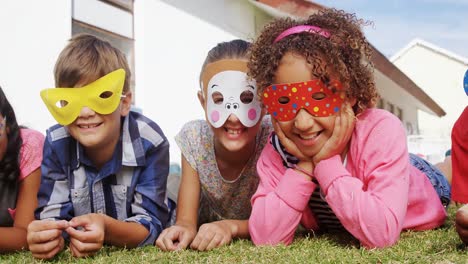 happy friends with eye mask lying on grass 4k