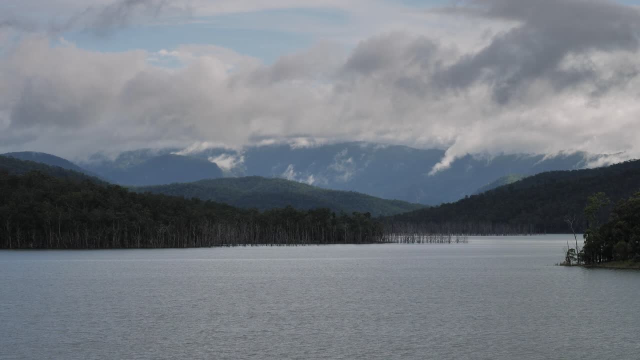 Wide view of rainy weather over Advancetown Lake in the Gold Coast Hinterland, Queensland, Australia.