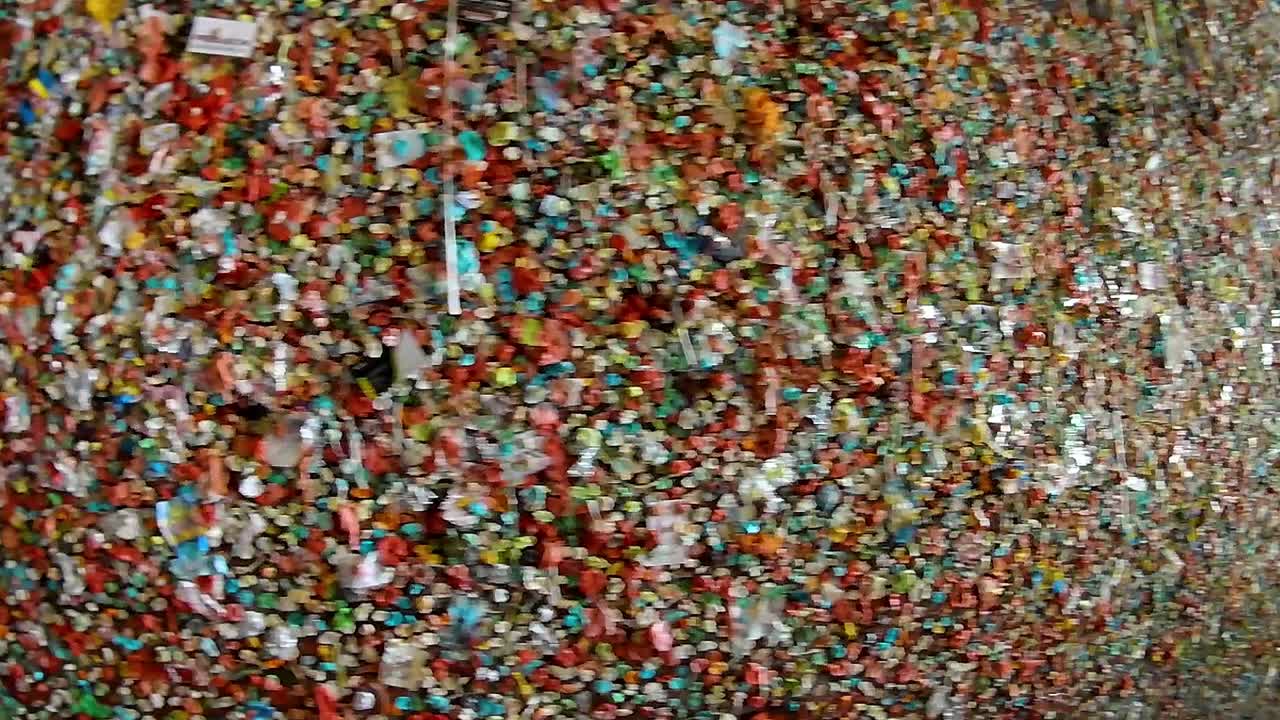 Gum wall, long shot, pan, Seattle Washington, city during the day.