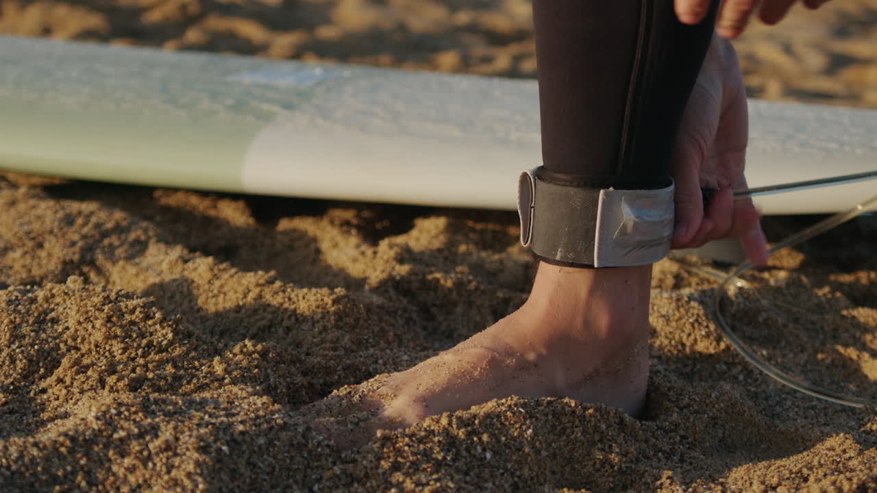 Surfer man walking to the beach at sunset preparing for surfing training and search for waves in Barcelona, spain, water, ocean exercise in sea with board, athletic male holiday or travel in vacation
