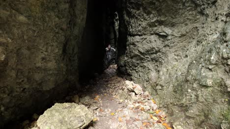 man walking through pokljuka gorge in slovenia during spring in the triglav national park-15