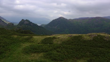 Slow-panning-shot-of-Castle-Cragg-from-High-Doad-in-Borrowdale,-Lake-District,-Cumbria,-England