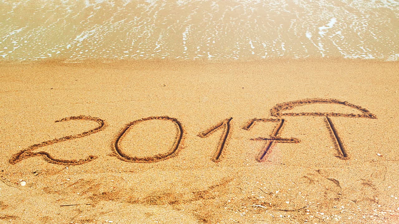2017 in the form of an inscription on sand, the beach. Shooting on the beach