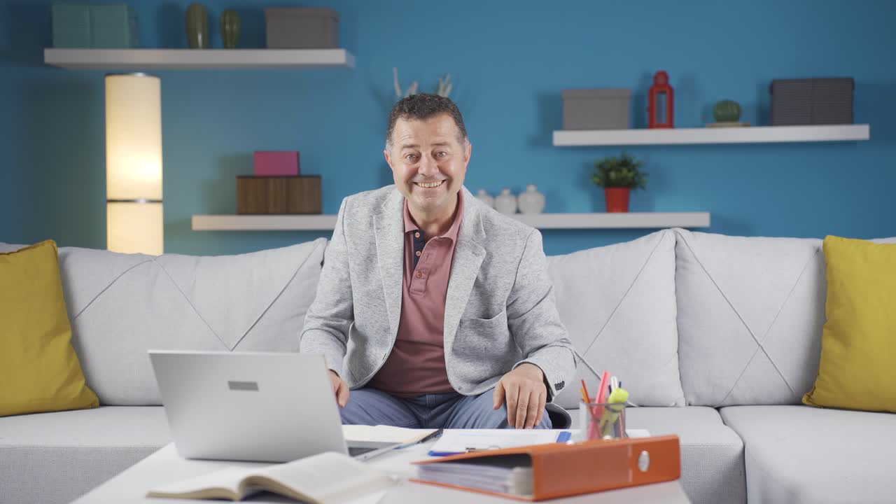 Home office worker man looking at camera with excitement and feeling happy.