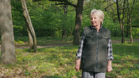 senior woman walking in a spring forest