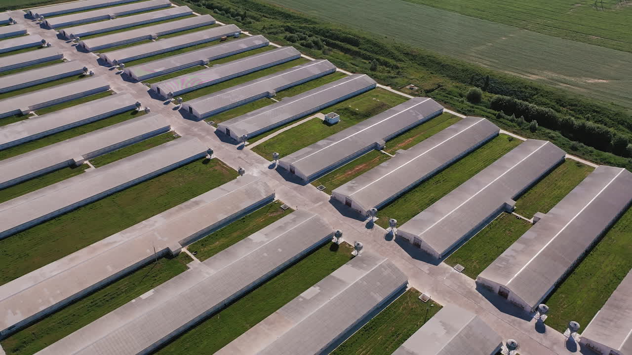 Industrial aerial view hangars. Technology modern countryside farming.