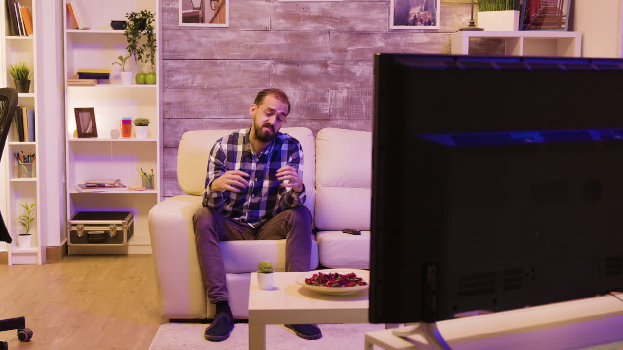 Man watching television in a cozy living room