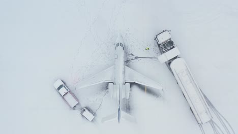 Top-down-of-private-business-jet-refueling-by-fuel-truck-in-Iceland