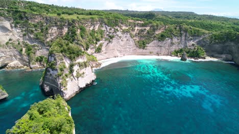 Aerial-drone-video-of-a-tropical-beach-on-Nusa-Penida-Island-in-Bali-Indonesia