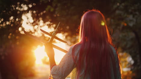 A-Child-Plays-A-Plane-In-The-Rays-Of-The-Setting-Sun