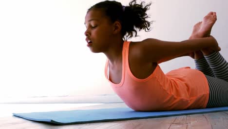 teenage girl practicing yoga