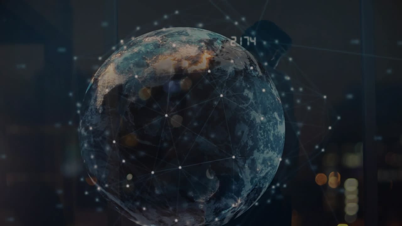 Businessman tapping tablet in office, activating rotating globe expanding tech data nodes
