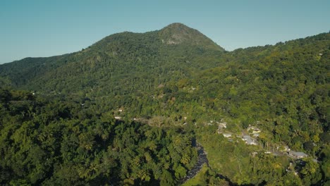 Drone-shot-of-hills-and-river-in-the-center-pulling-up