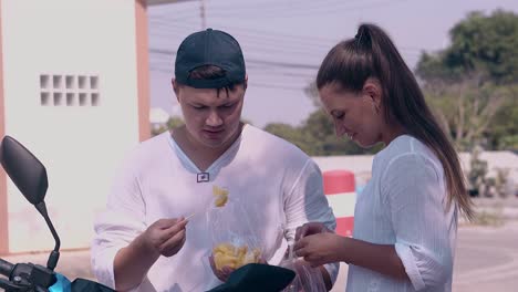 beautiful brunette with ponytail brings street food