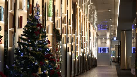 decorated christmas tree in a well-lit corridor