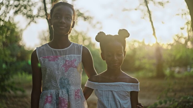 Two African American girls in a park