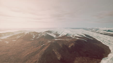 large-snow-patch-left-over-on-the-volcanic-rock-field-of-a-mountain-in-summer