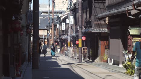 slide shot of people walking in the streets in kyoto, japan 4k slow motion