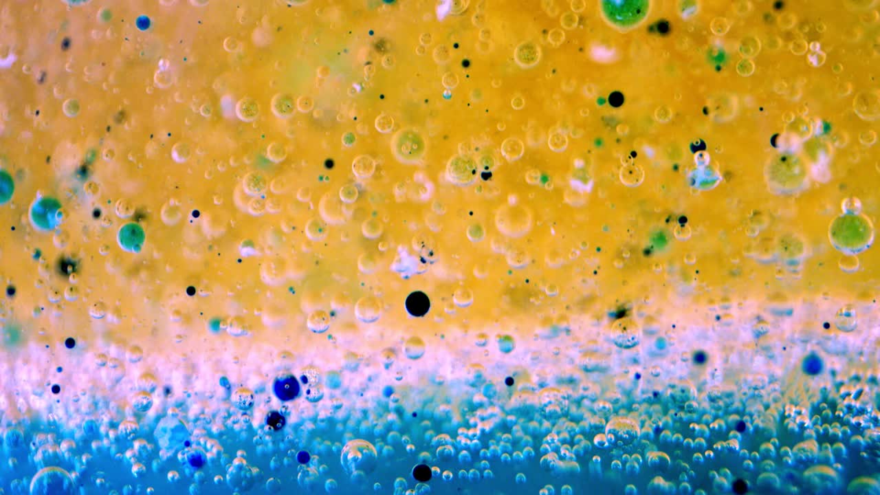 Bubbles In Oil And Water With Ink Behind Glass