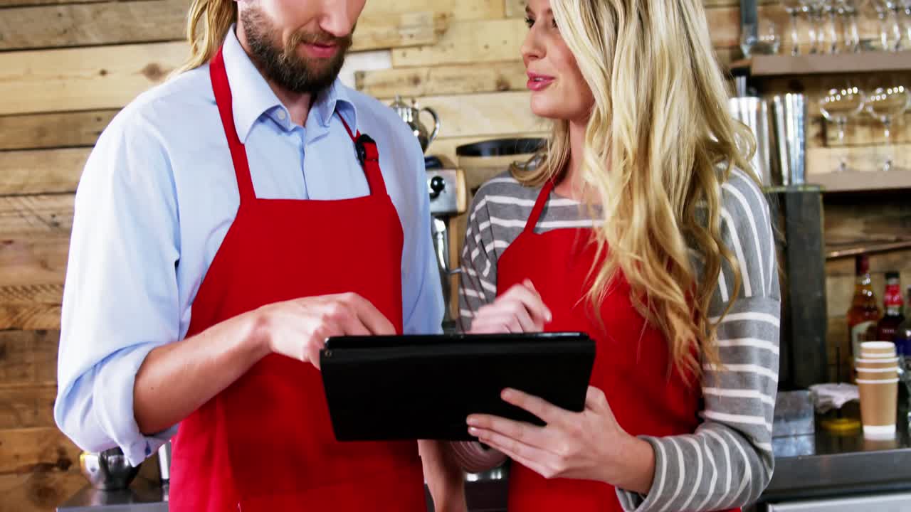 Waiter and waitress using digital tablet