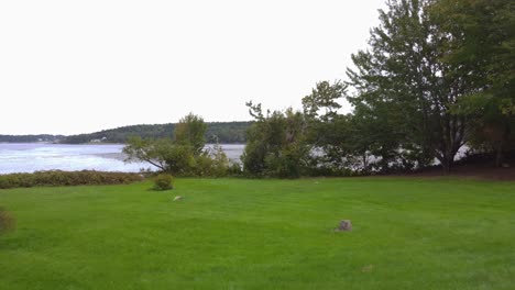 push in over lawn in maine by the ocean