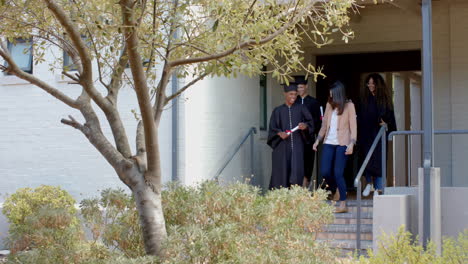 Diverse-students-descend-high-school-steps,-with-copy-space