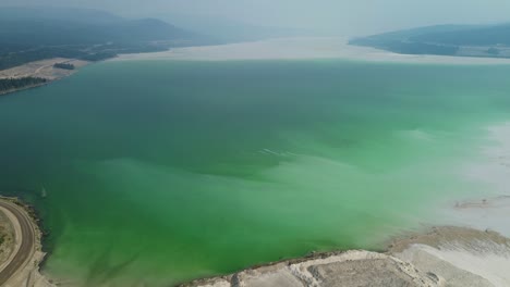 Aerial-Drone-Reveals-Highland-Valley-Copper-Mine-Tailing-Pond-Viewpoint-Over-Turquoise-Lake-and-Surrounding-Landscape-in-Canada