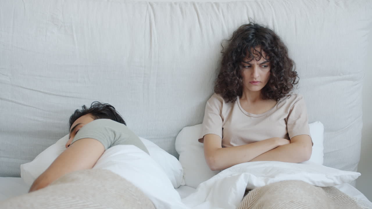 Couple Arguing in Bed