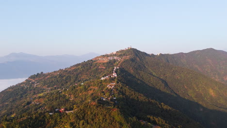 panoramic drone shot around the sarangkot hill, hazy sunrise in pokhara, nepal