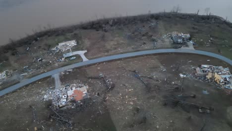 aerial overview of a lakeside neighborhood destroyed by a tornado on lake barkley, kentucky. 2021-12-10. beautiful lake homes were destroyed by a very strong tornado. dramatic debris trail visible