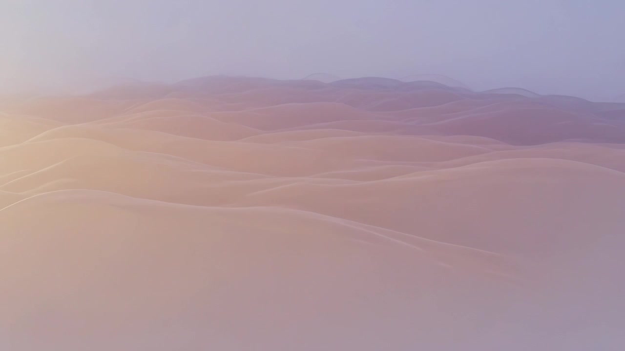 Campo di dune bagnato dalla calda luce del sole che sorge da sinistra, le dune rivelano increspature e una foschia di altopiano distante.