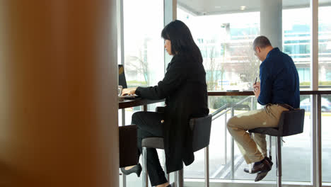 executives working while having coffee