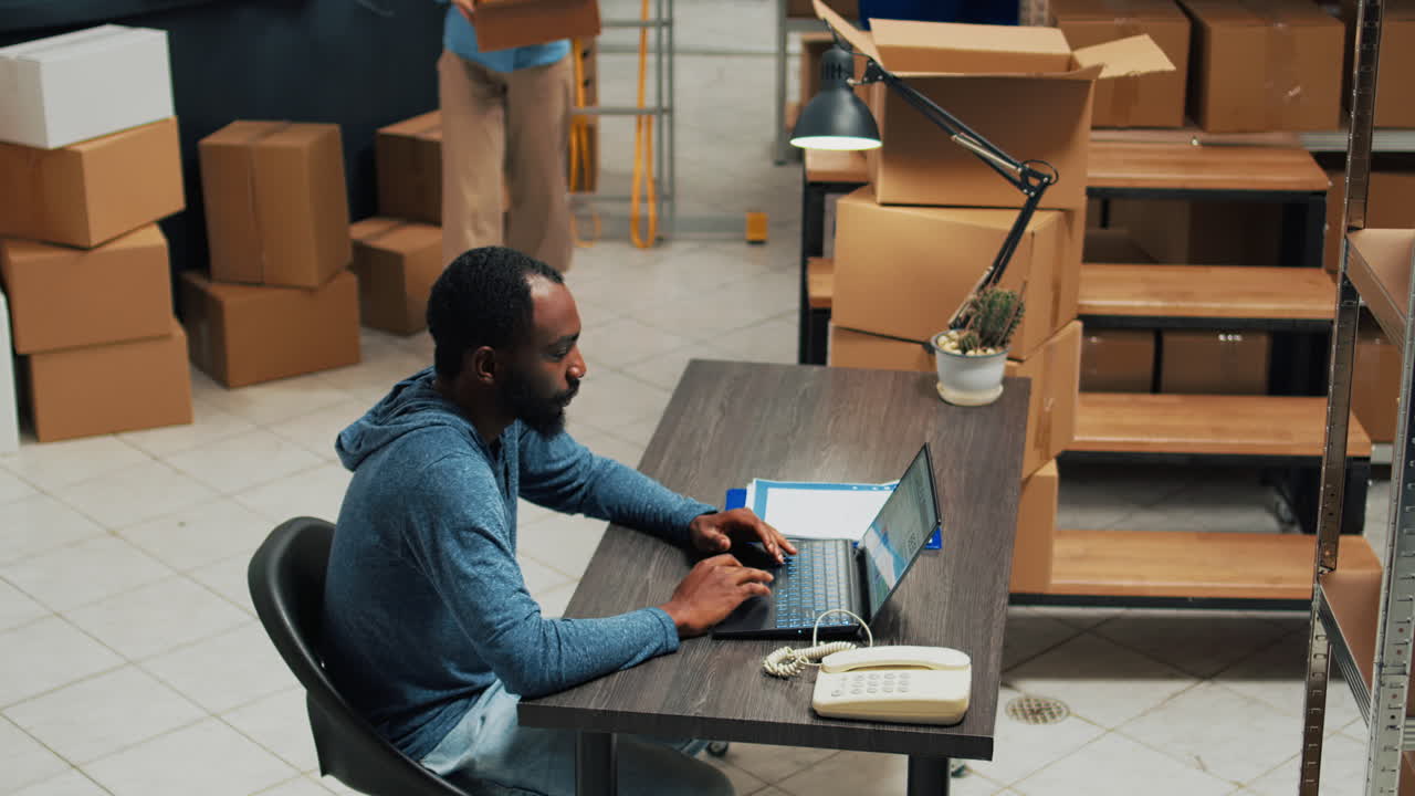 People working at a desk in an office