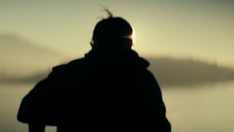 silhouette of person at sunrise