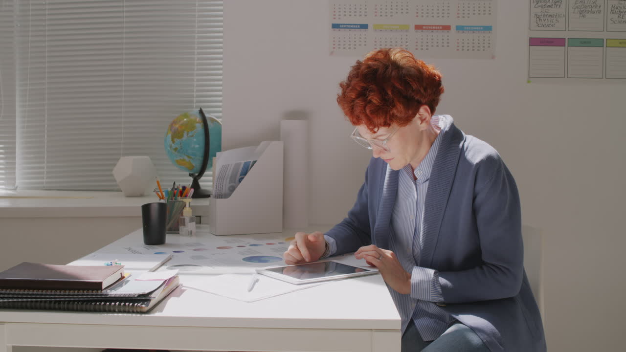 Teacher Using Tablet During Lesson