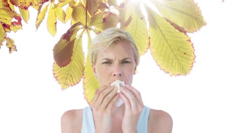 Woman-sneezing-while-suffering-from-allergy-against-autumn-leaves-4k