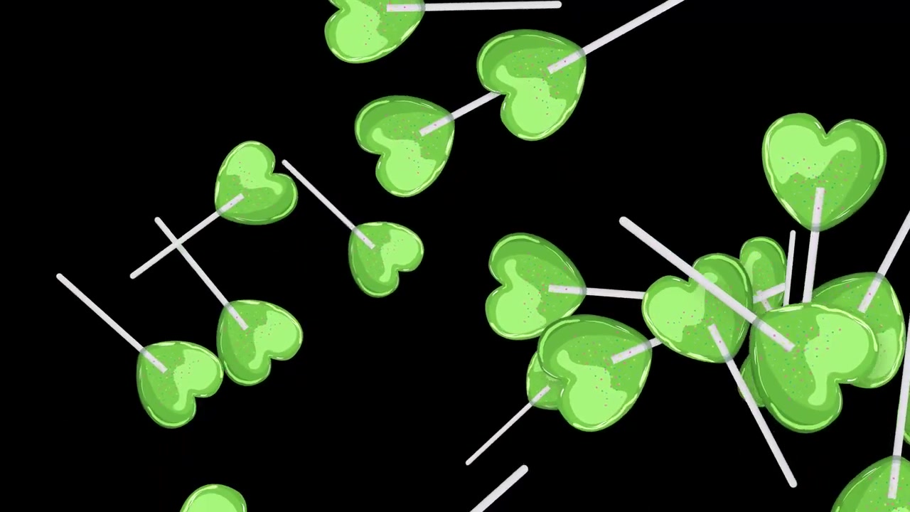 Green Heart-Shaped Lollipops Floating Against Black Background