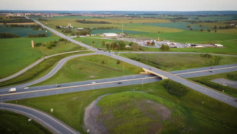 a busy highway in a sprawling agricultural countryside