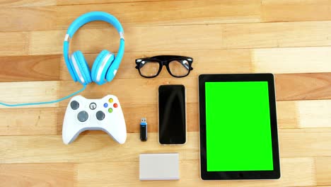 digital tablet, mobile phone, usb flash drive, joystick, headphones and spectacles