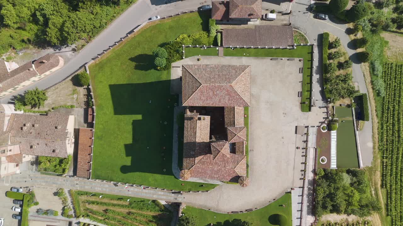Grinzane Cavour castle, UNESCO site, Cuneo, Piedmont, Italy. 4k aerial view of the castle together with the Vineyard. Langhe-Roero and Monferrato. Top down zenital descending