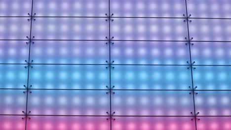 zoomed in shot of color-changing led lights on modern electronic billboard sign