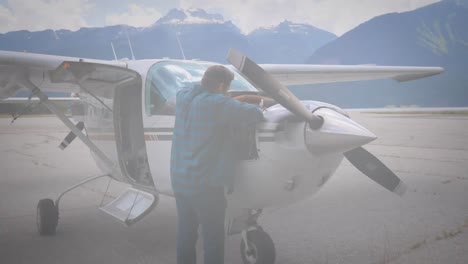 animation of caucasian engineer fixing airplane over globe