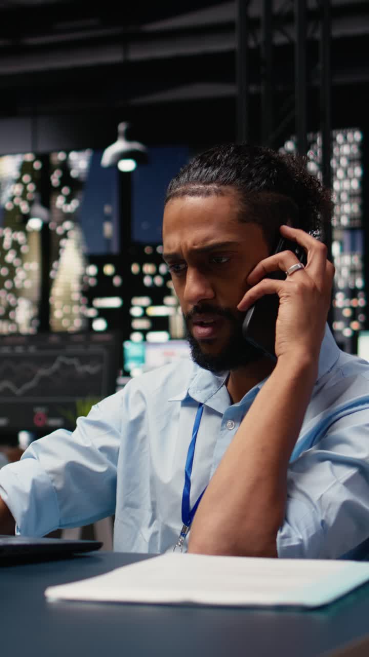 Vertical Video Arab man with disability, telephone call chat, during office work session