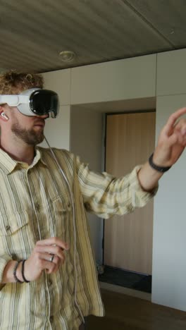 man wearing vr headset in modern home