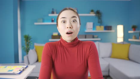 young asian woman makes a confused facial expression towards the camera.