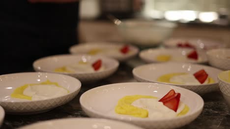 chef plating an italian marscapone dessert plate